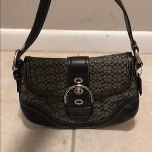 Coach purse with Buckle Flap Closure